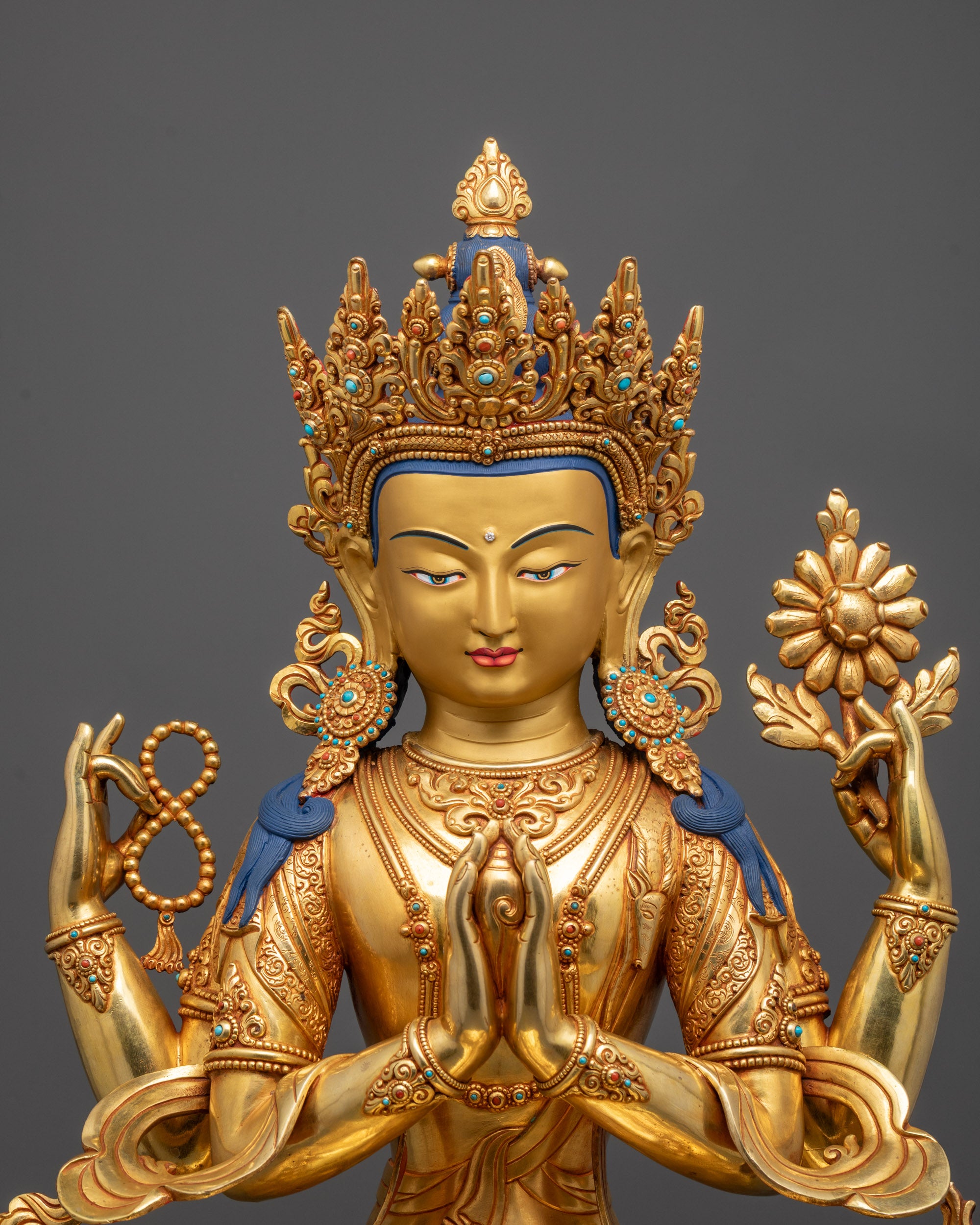 Close up of Chenrezig’s five-jeweled crown and hand-carved patterns with semi-precious stones