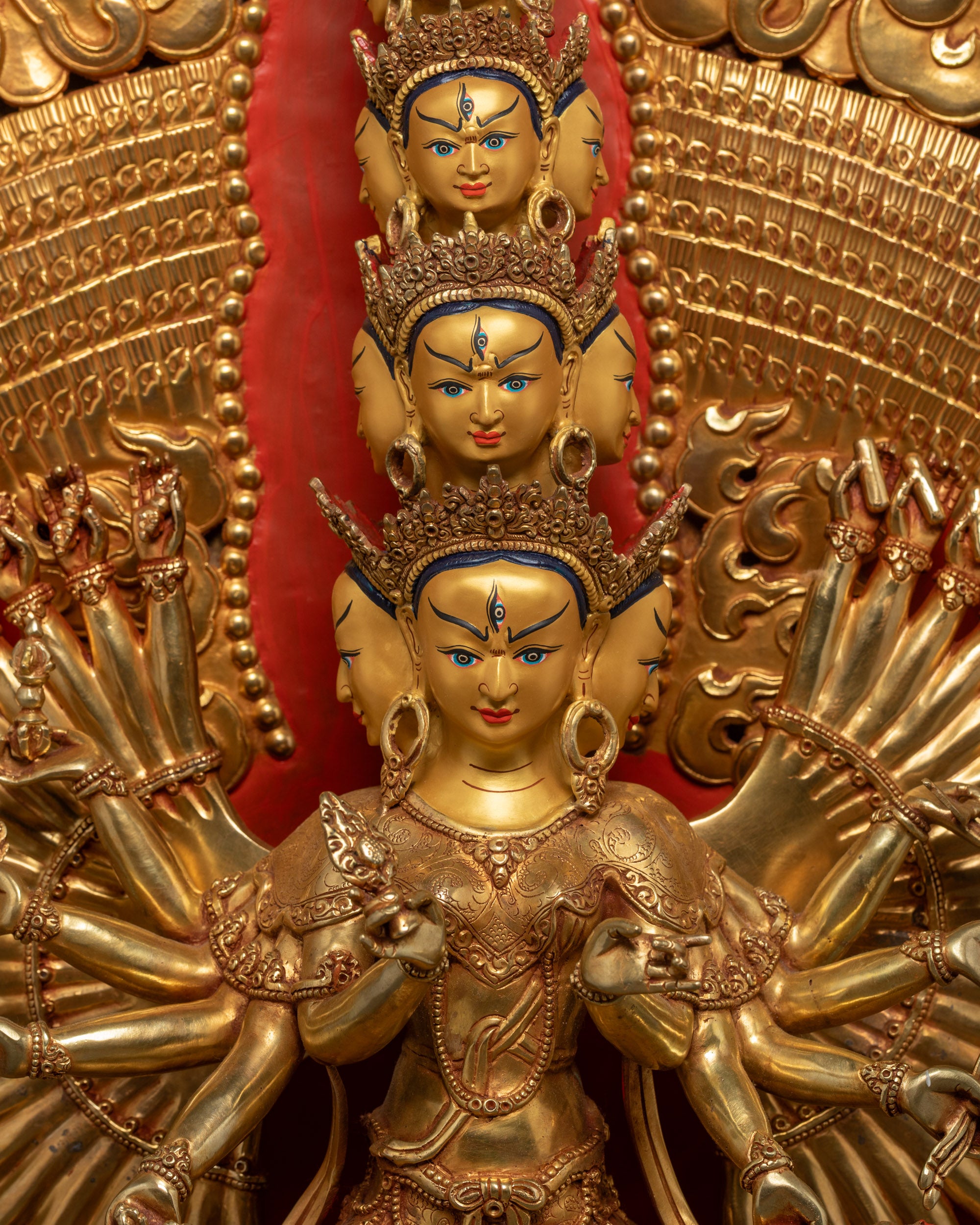 Close up of Dukar Statue showing intricate arms holding symbolic implements
