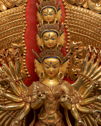 Close up of Dukar Statue showing intricate arms holding symbolic implements
