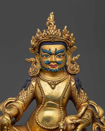 Close up of Dzambhala’s wrathful face, five-jeweled crown, and intricate jewelry
