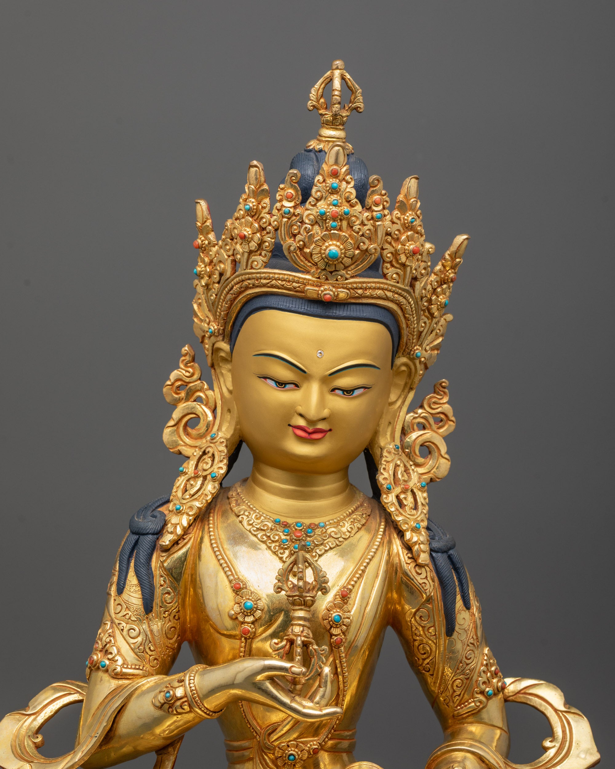 Close up of Five-Jeweled Crown and semi-precious stones on Vajrasattva Statue