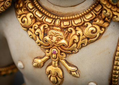 Close up of Garuda carved necklaces showing gold-gilded and fine hand-painted craftsmanship