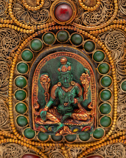 Close up of Green Tara carving on Tibetan rice pot
