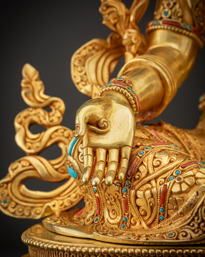 Close up of Green Tara left hand in abhaya mudra on lotus seat