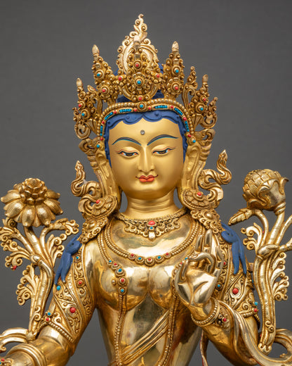 Close up of Green Tara statue handcrafted gold fire-gilded Nepalese copper art
