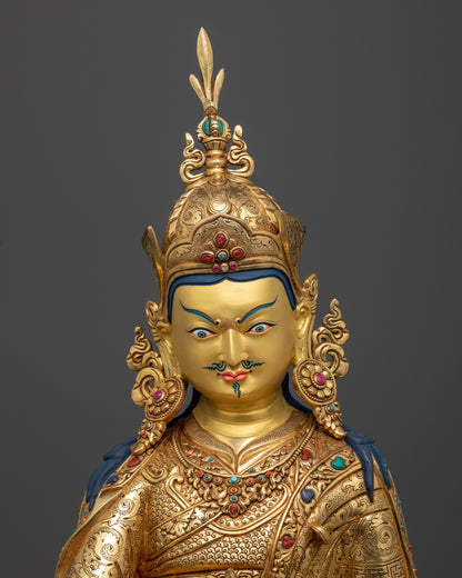 Close up of Guru Pema Jungne gold-painted face with lotus hat and semi-precious stones, hand-carved Newari Himalayan statue