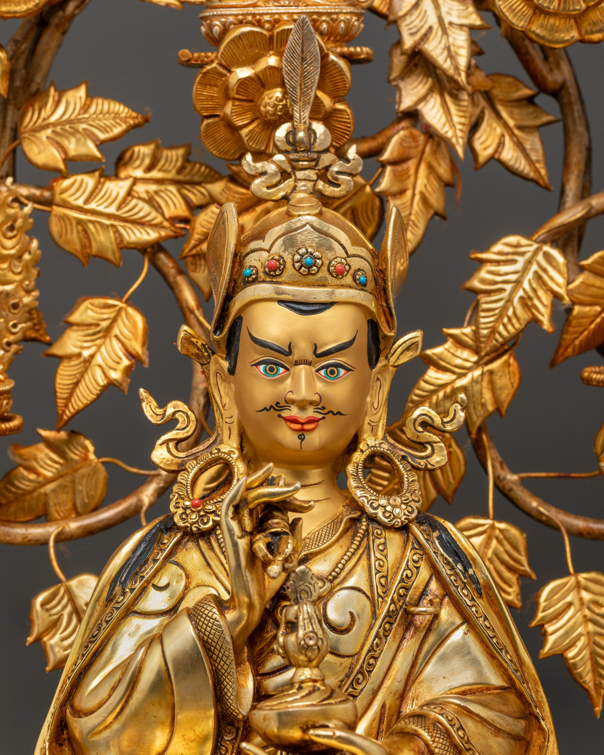 Close up of Guru Sangey semi-wrathful face and detailed dorje, skullcup, khatvanga
