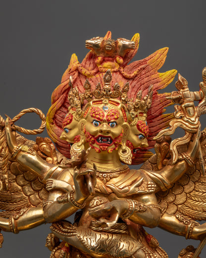 Close up of Hayagriva Statue showing Gold-gilded three fierce faces and intricate Dhoti robe details
