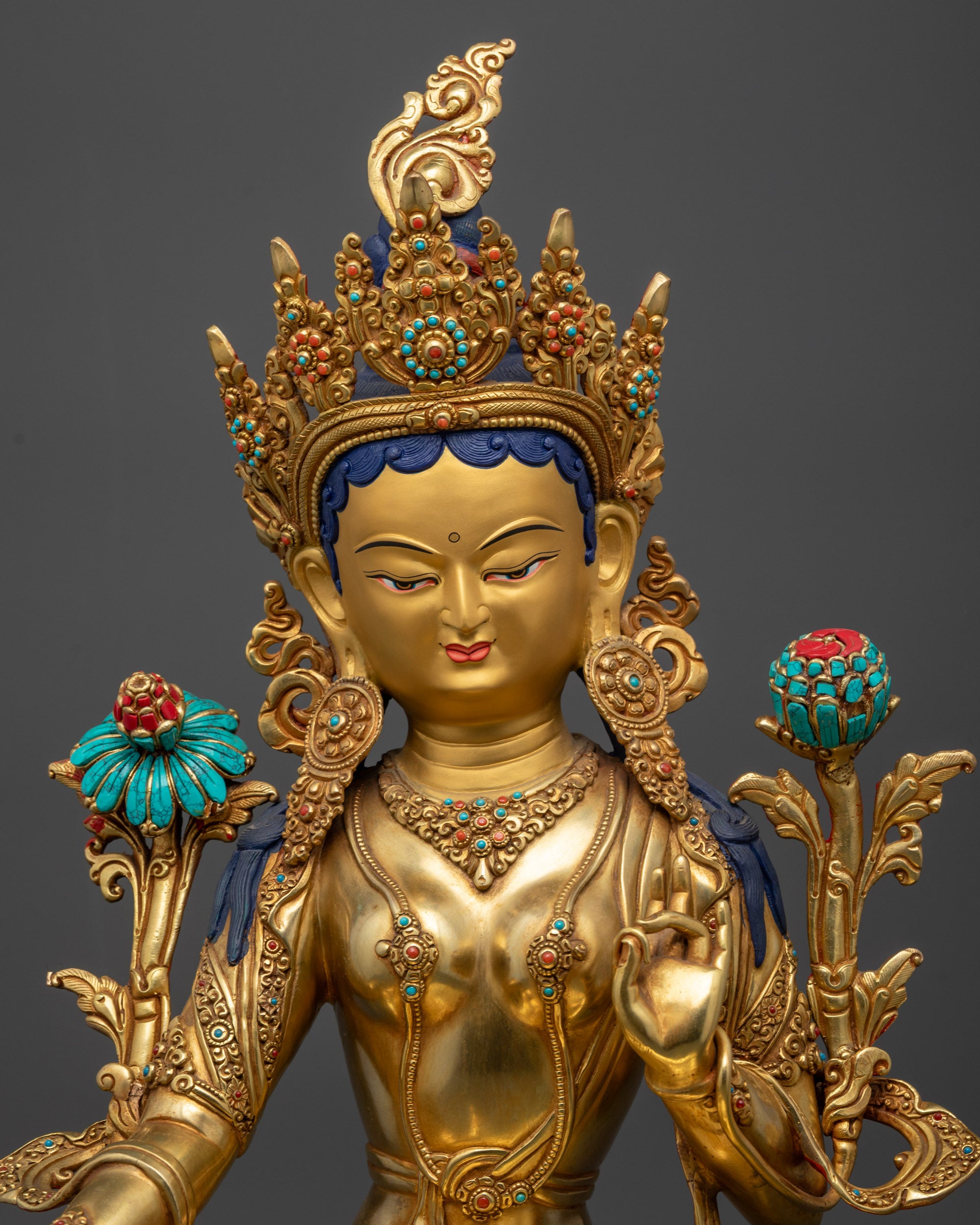 Close up of Jetsun Drolma Statue showing gold-gilded face, jewels, and intricate carvings