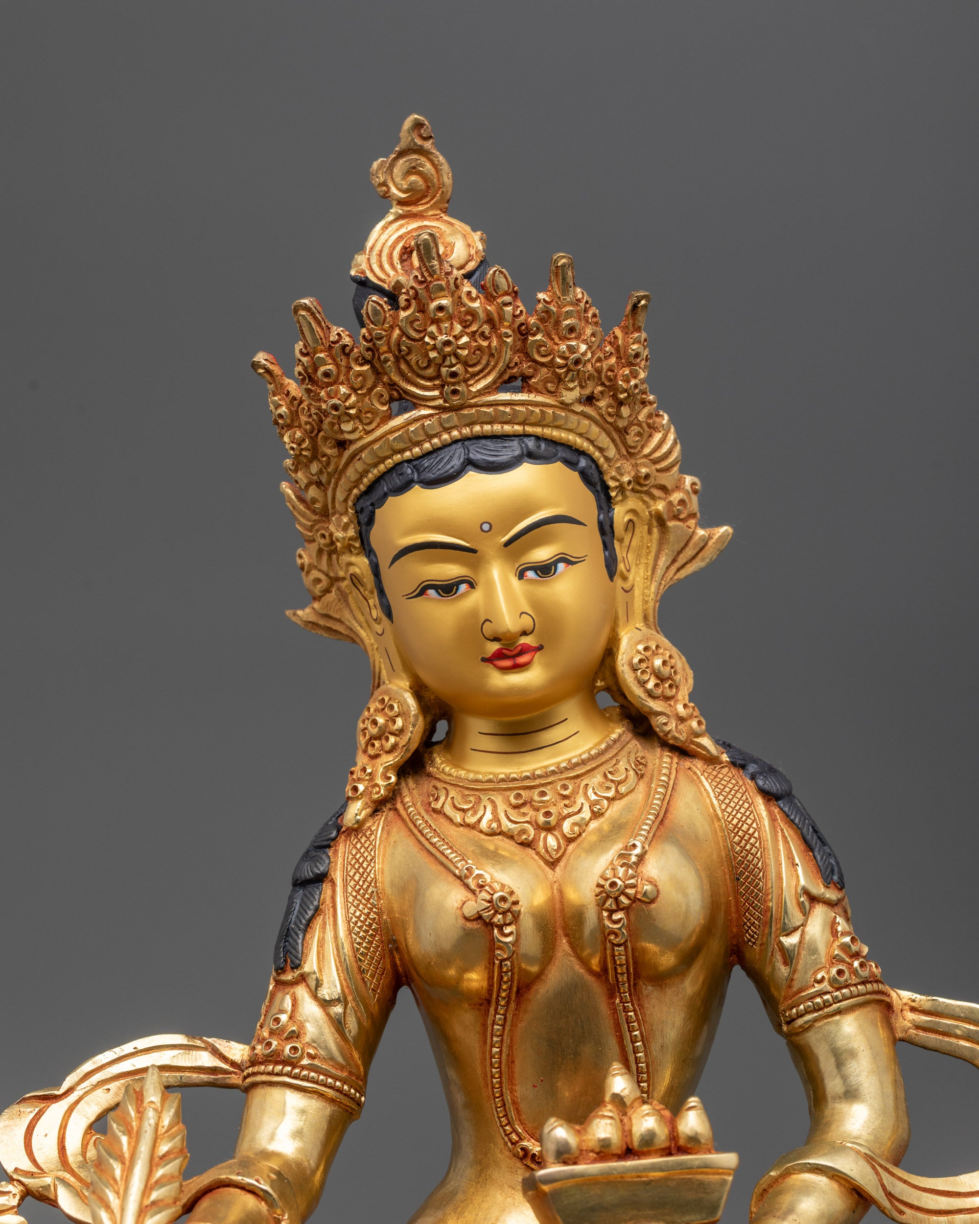 Close up of Ksitigarbha Statue showing gold-fire gilded crown and intricate details
