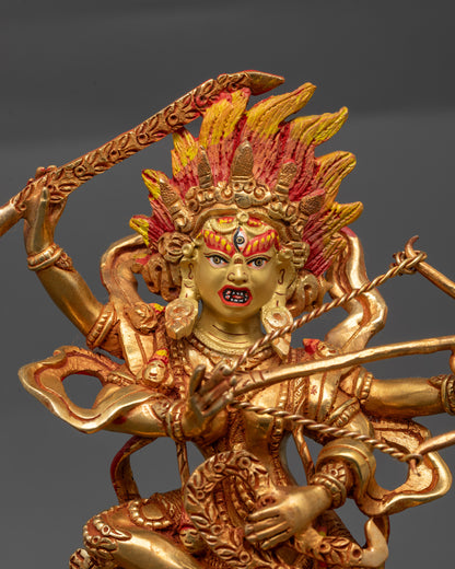Close up of Kurukulla statue showing third eye, five-skull crown, and flower arrows
