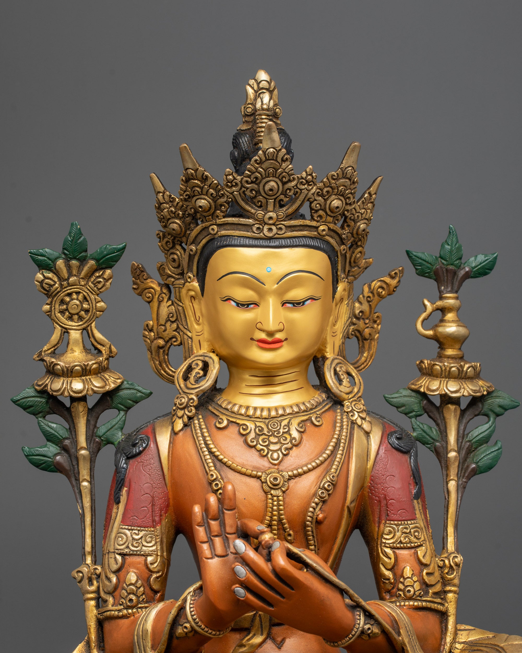 Close up of Maitreya Buddha's Five-Jeweled Crown and dharmachakra mudra details