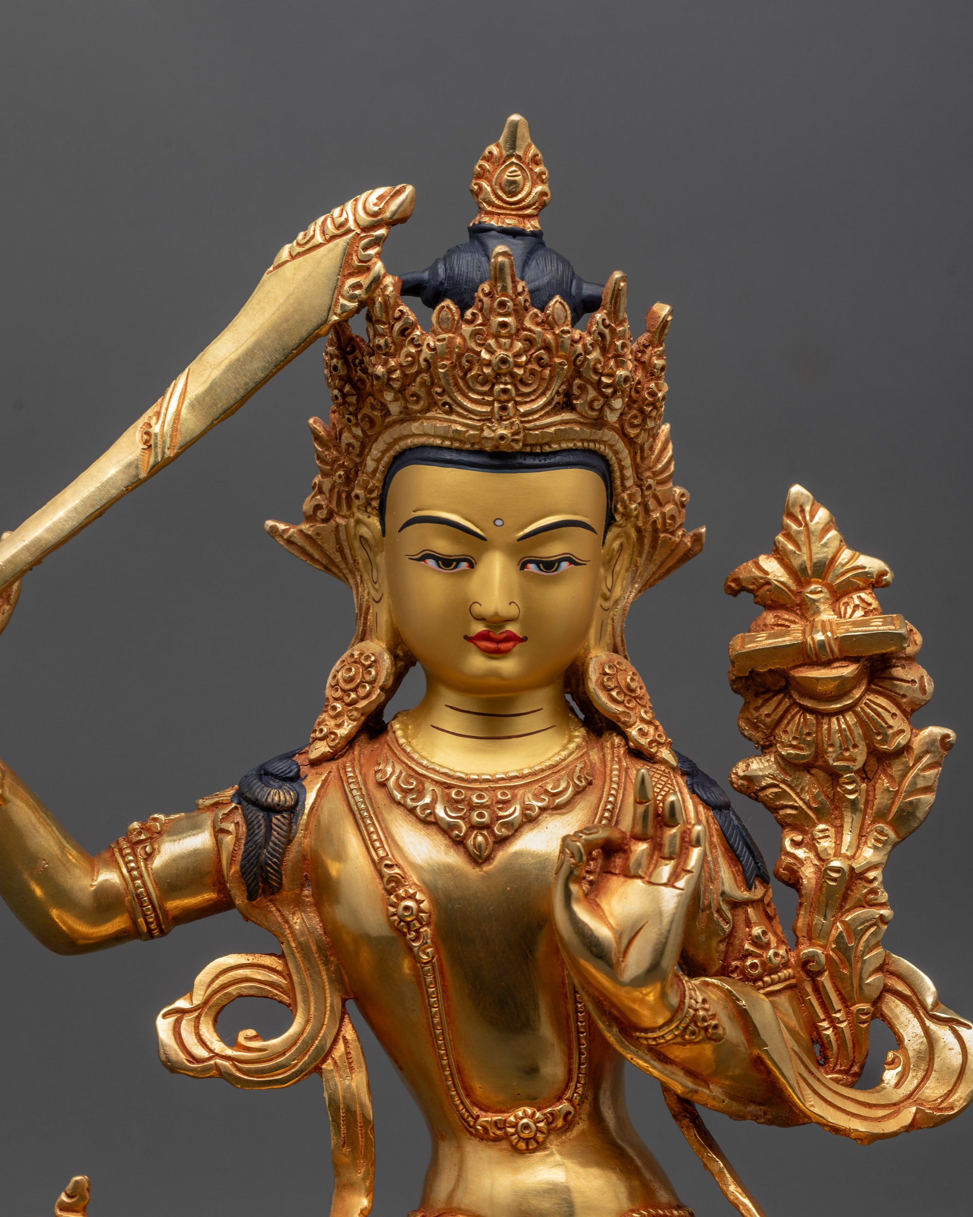 Close up of Manjushri Sculpture showing intricate 24k gold fire-gilded details
