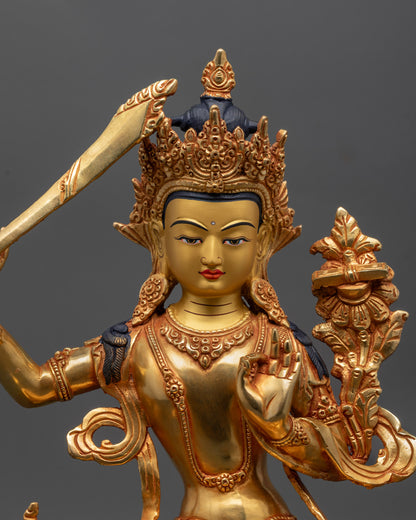 Close up of Manjushri Sculpture showing intricate 24k gold fire-gilded details