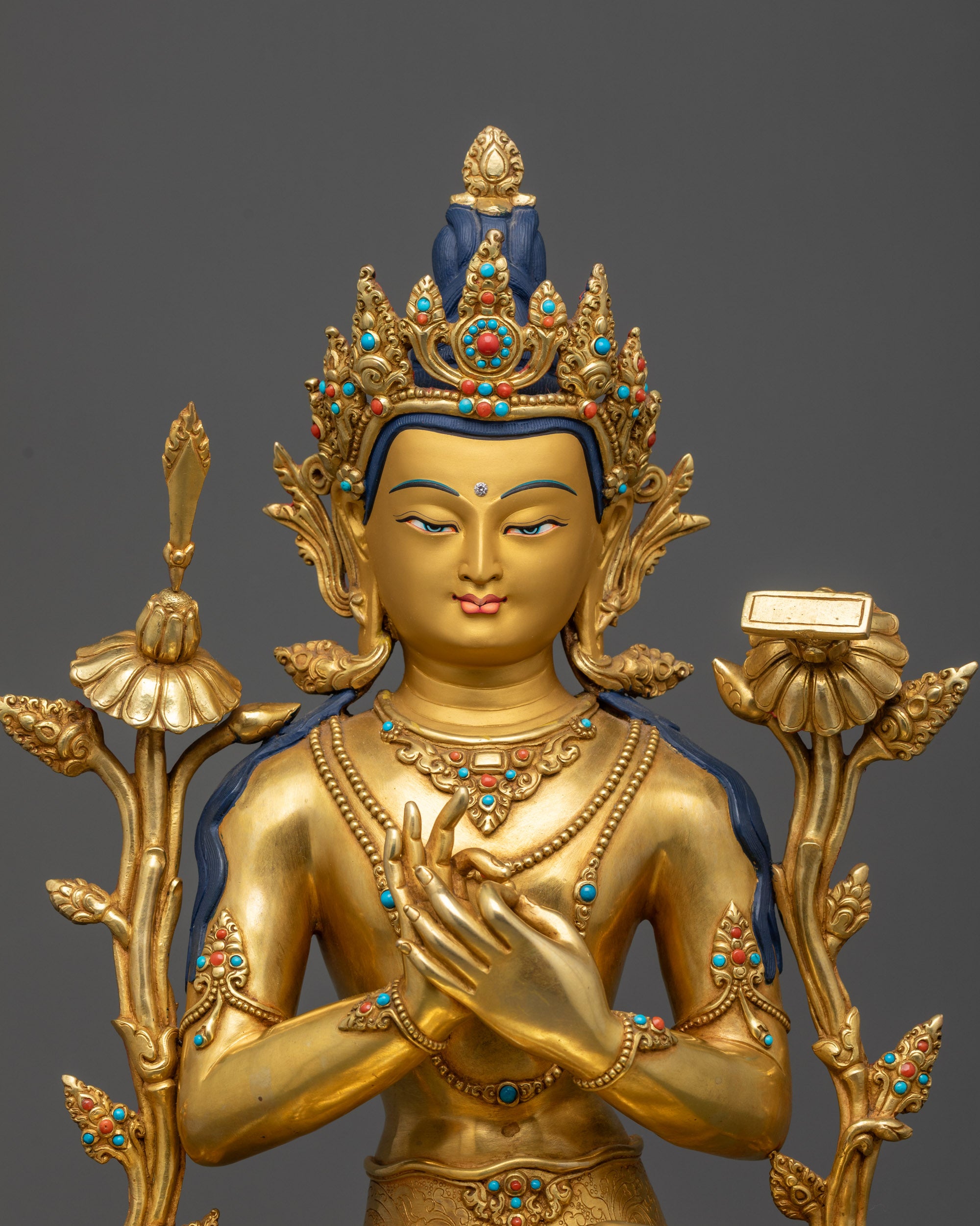Close up of Manjushri gold-gilded face with five-jeweled crown