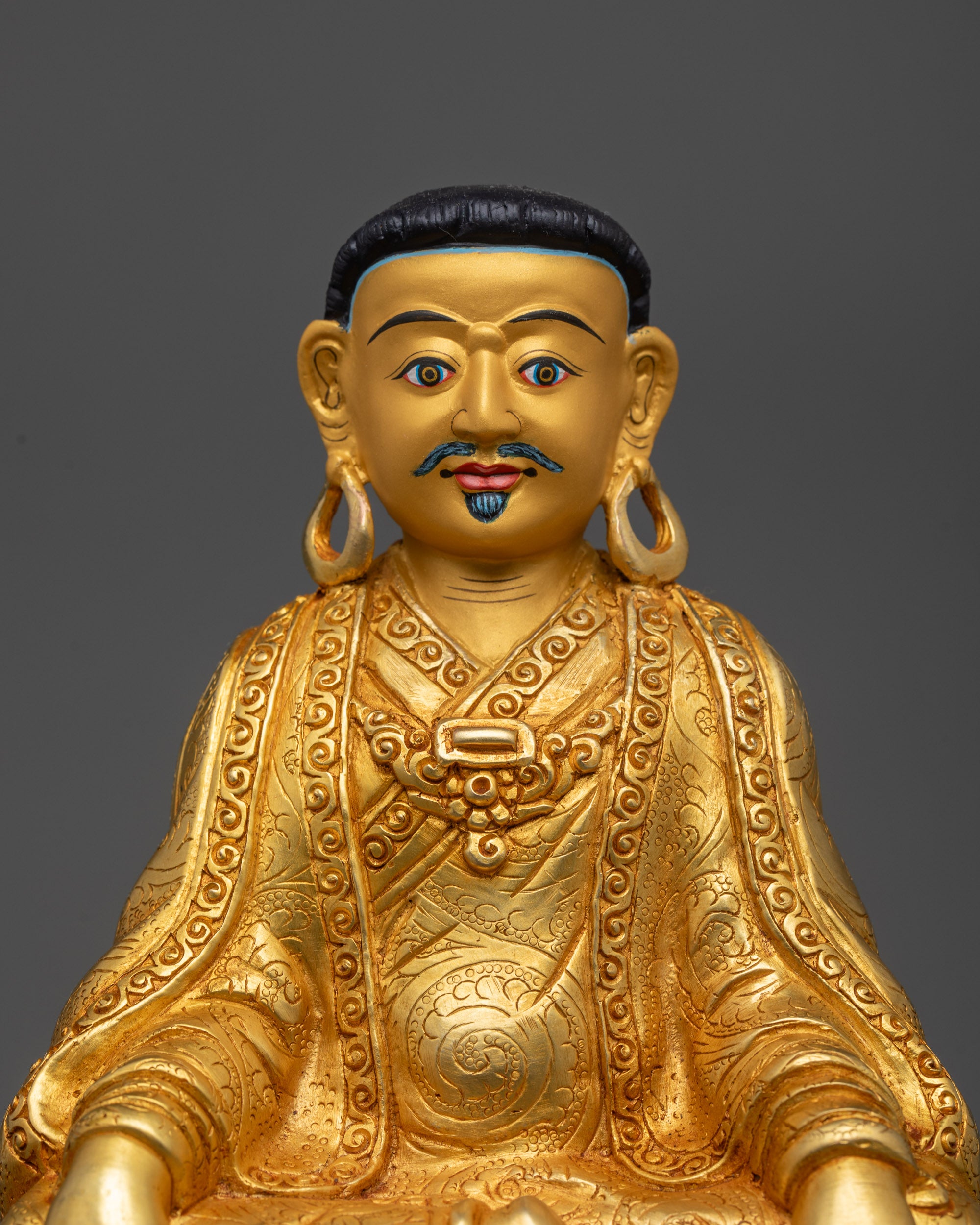 Close up of Marpa Statue showing intricate carved garments and jewelry details