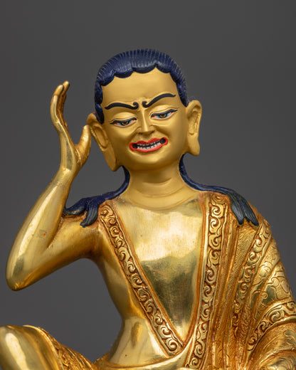 Close up of Milarepa statue face showing semi-wrathful expression and attentive gaze