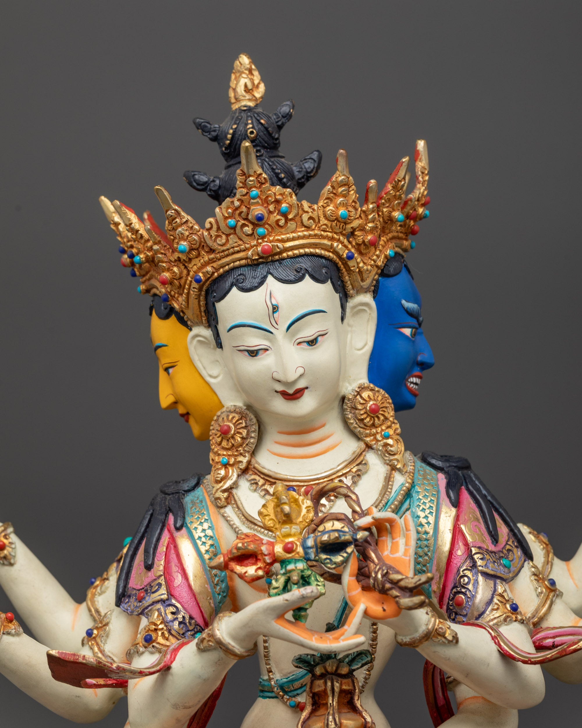 Close up of Namgyalma Statue showing intricate crown, jewelry, and sacred objects