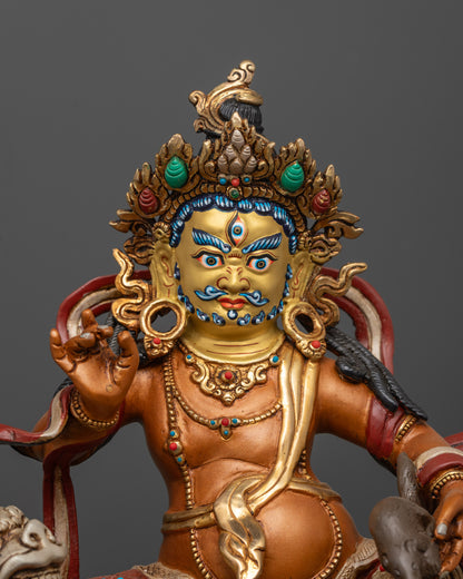 Close up of Namtoshe Sculpture showing gold-gilded face and intricate semi-precious stones