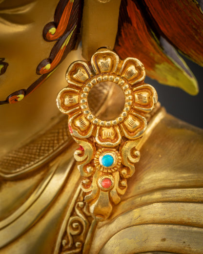 Close up of Nechung Chuyong Statue Earrings right side showing gold detailing