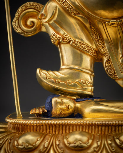 Close up of Nechung Chuyong Statue crushing obstacles on lotus seat, wrathful protector deity
