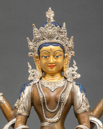 Close up of Prajnaparamita statue holding sutra and vajra