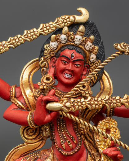 Close up of Red Rigjema Kurukulla Statue with gold-gilded skull garland