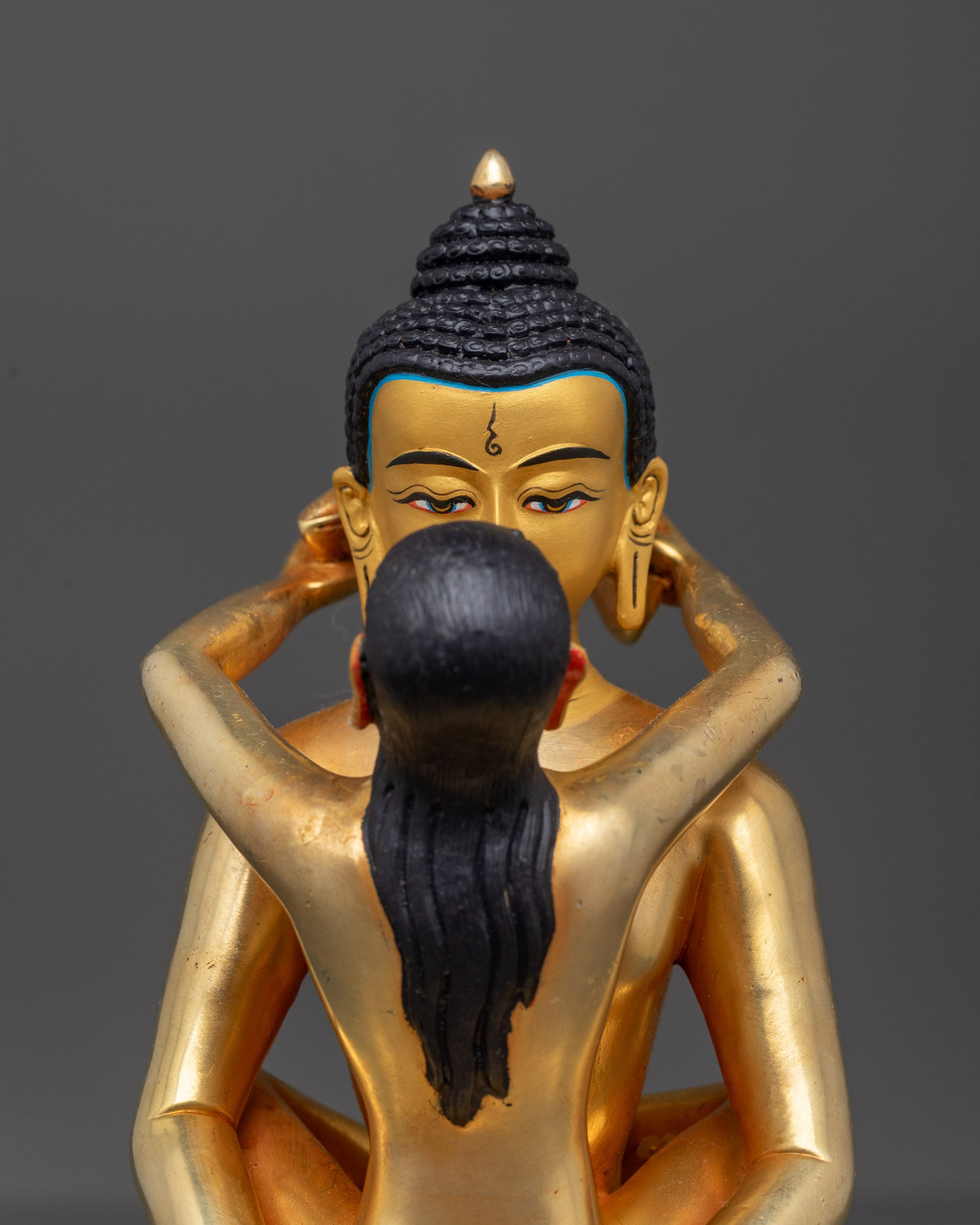 Close up of Samantabhadra & Samantabhadri statue highlighting gold-fire-gilded details