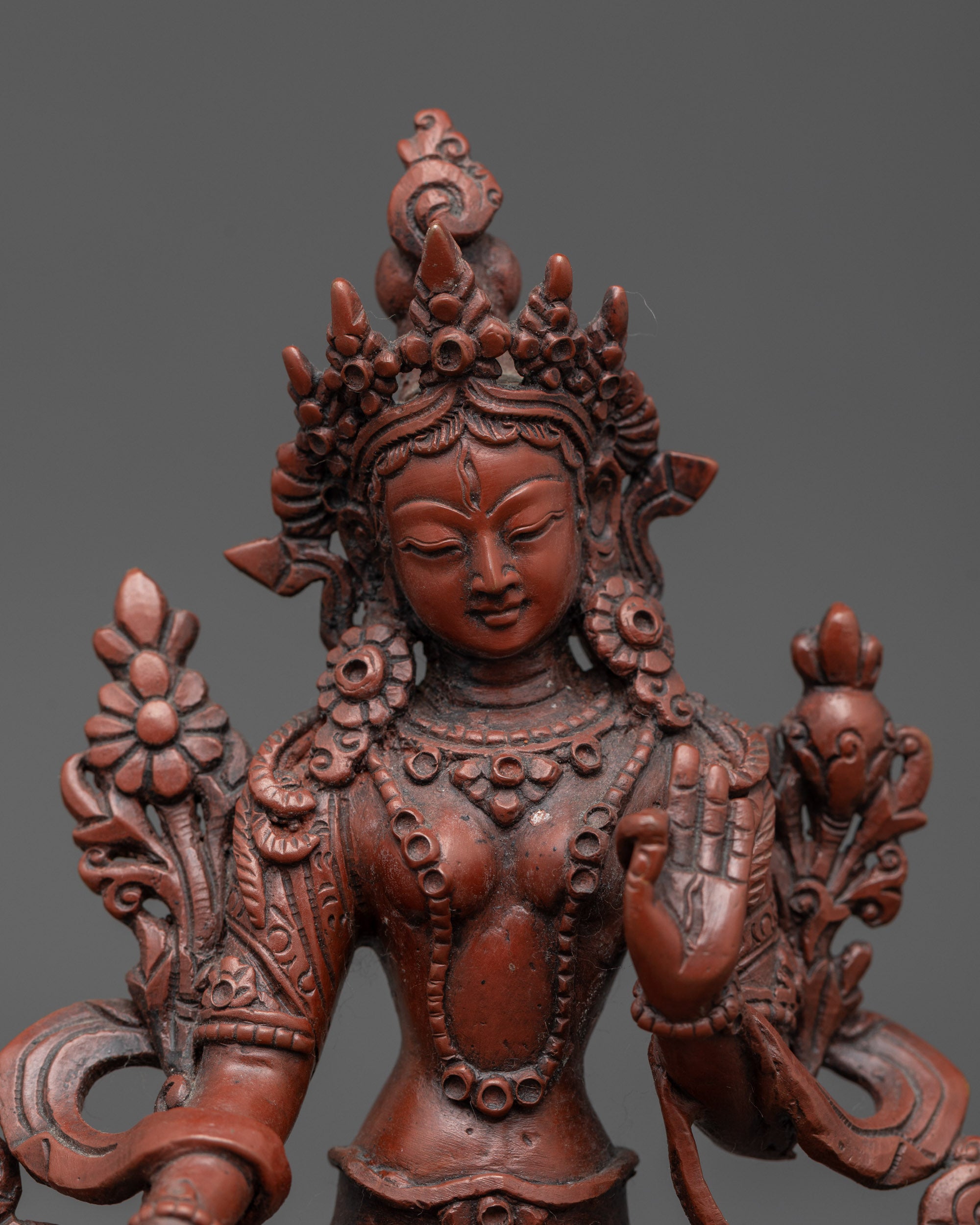 Close up of Sapta Lochani Statue showing seven eyes and detailed jewelry craftsmanship
