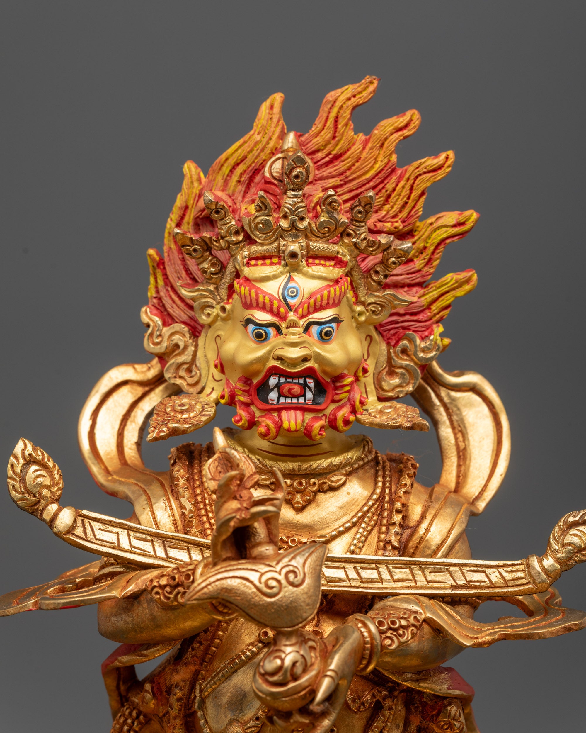 Close up of Shakya Mahakala Statue showing five-skull crown and wrathful expression
