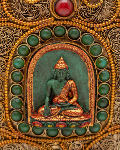 Close up of Shakyamuni Buddha carving on ritual rice pot