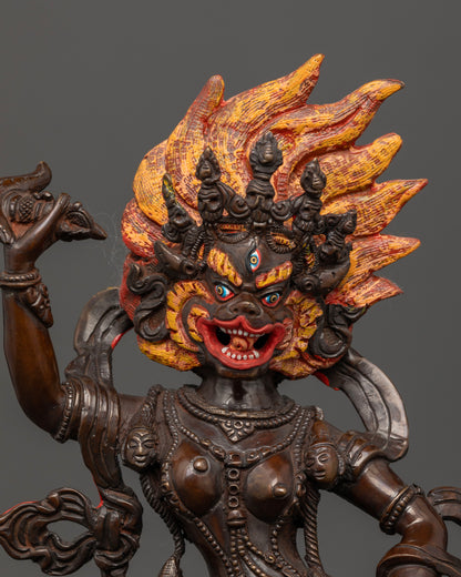 Close up of Simha Mukha statue highlighting intricate adornments and ritual implements