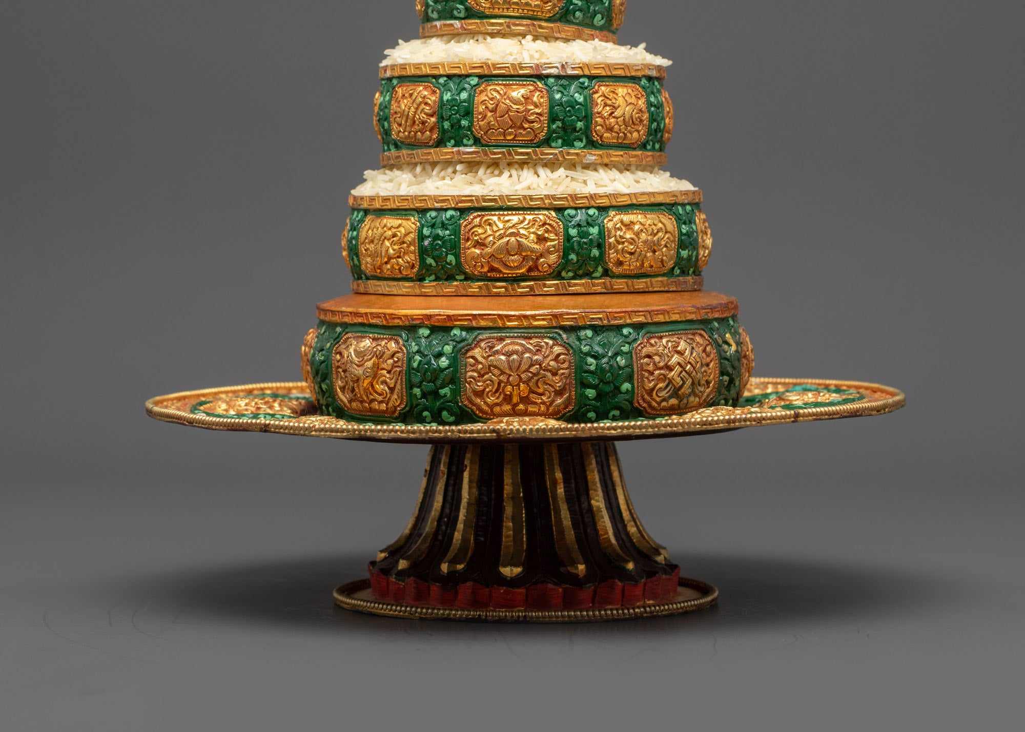 Close up of Tibetan Mandala rings filled with grains and jewels