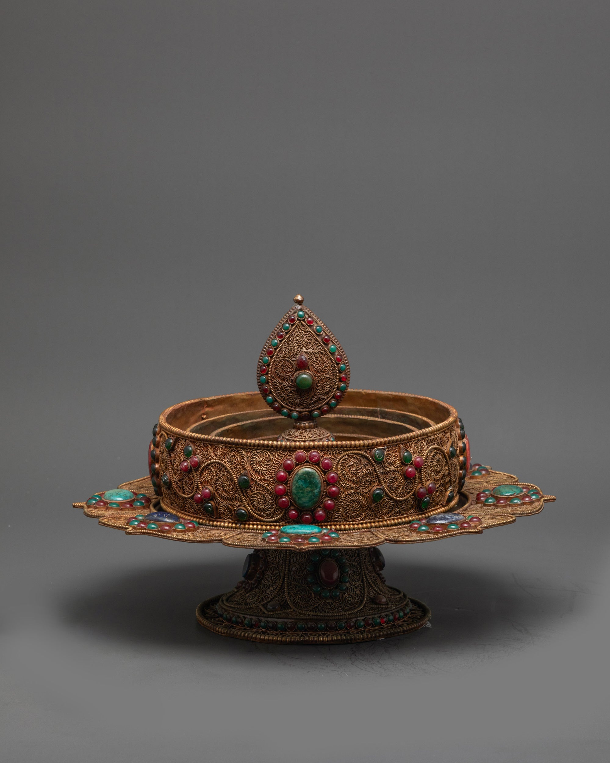 Close up of Tibetan Mandala showing detailed filigree work and floral patterns