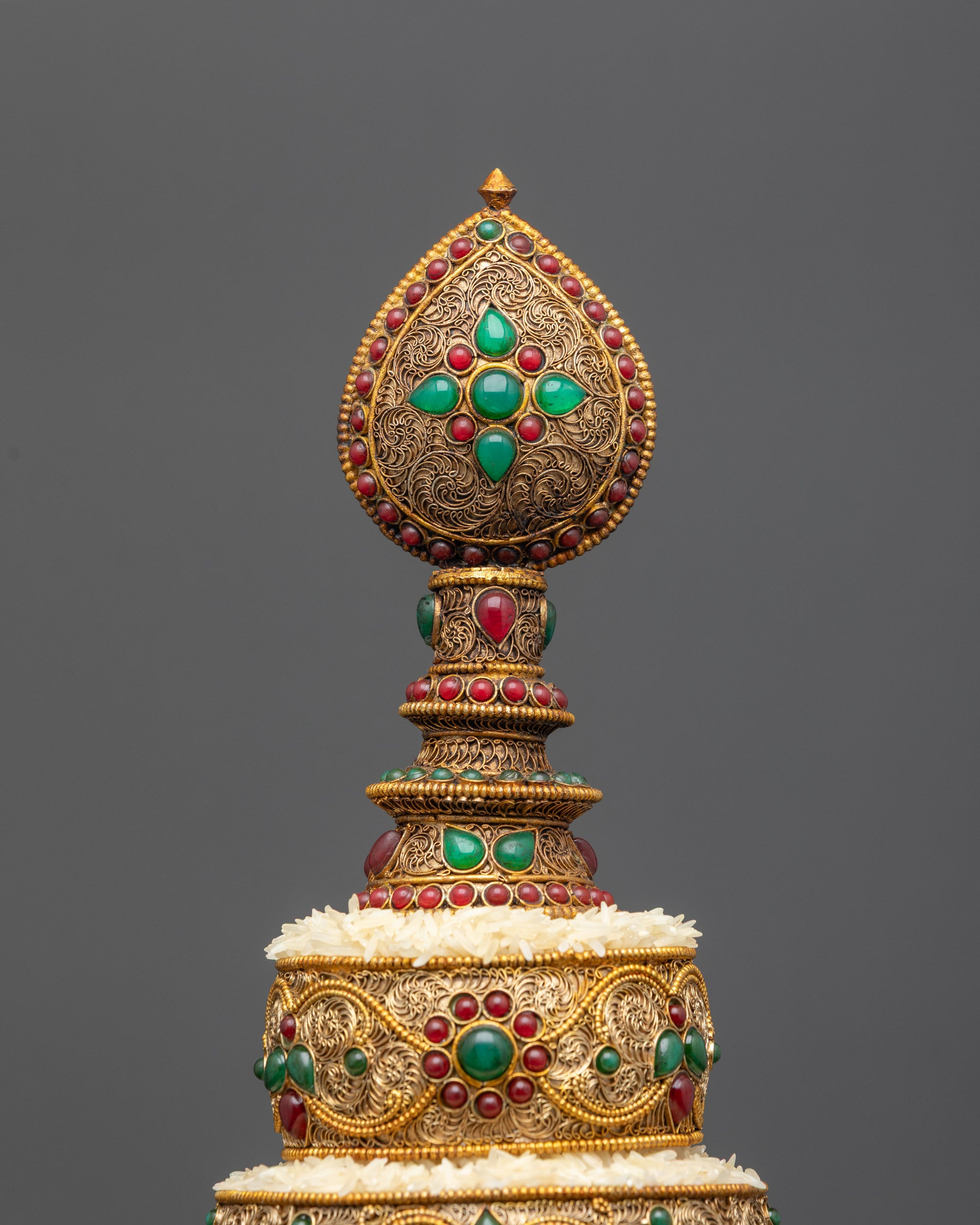 Close up of Tibetan Mandala showing intricate copper design and gold-plated details
