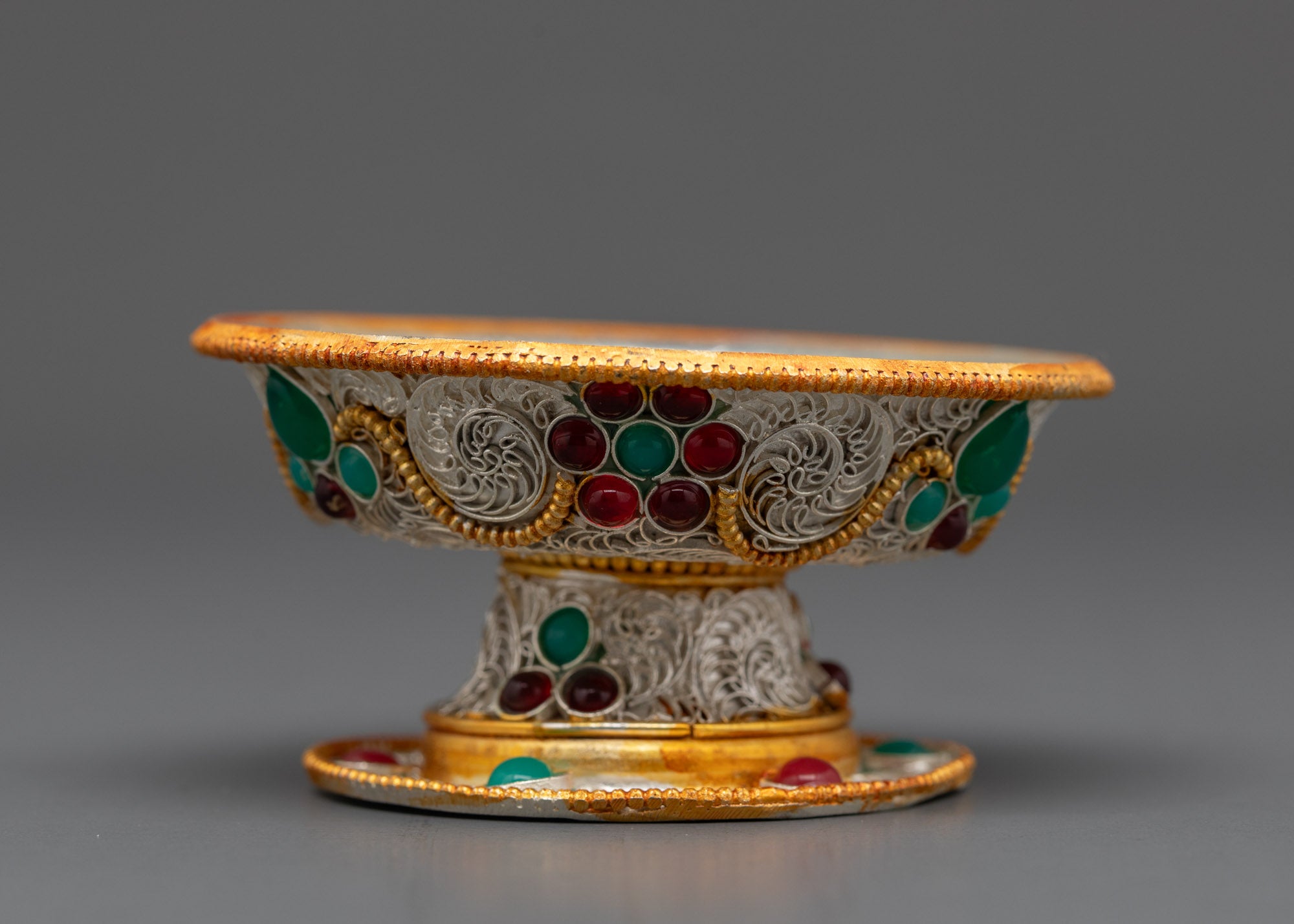 Close up of Tibetan Serkyem Offering Bowl showing intricate silver and gold filigree work