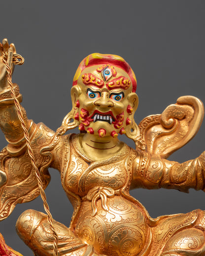 Close up of Tsengo Rolpa Chudan Statue showing wrathful expression and carved staff details
