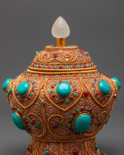 Close up of Turquoise and ruby gemstones on Neshi Rice Pot for Buddhist rituals