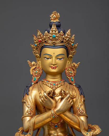 Close up of Vajradhara statue showing five-jeweled crown and semi-precious earrings