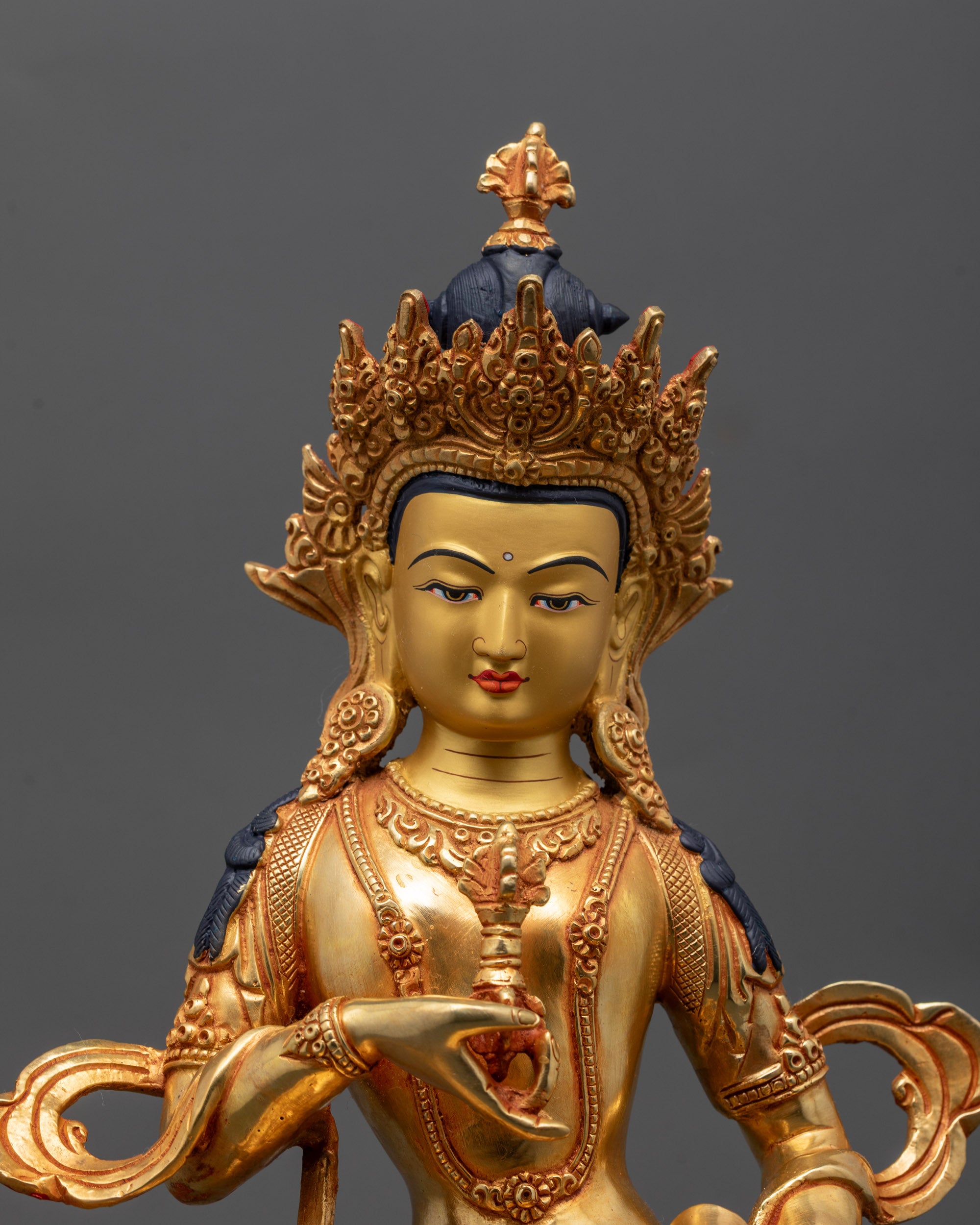 Close up of Vajrasattva Dorje Sempa holding vajra and bell, showing intricate details