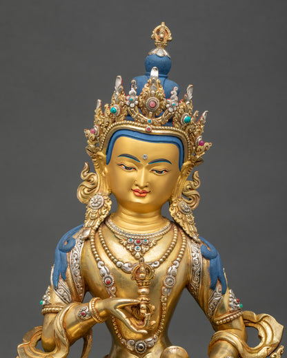 Close up of Vajrasattva Dorje Sempa statue with gold gilding and gemstones