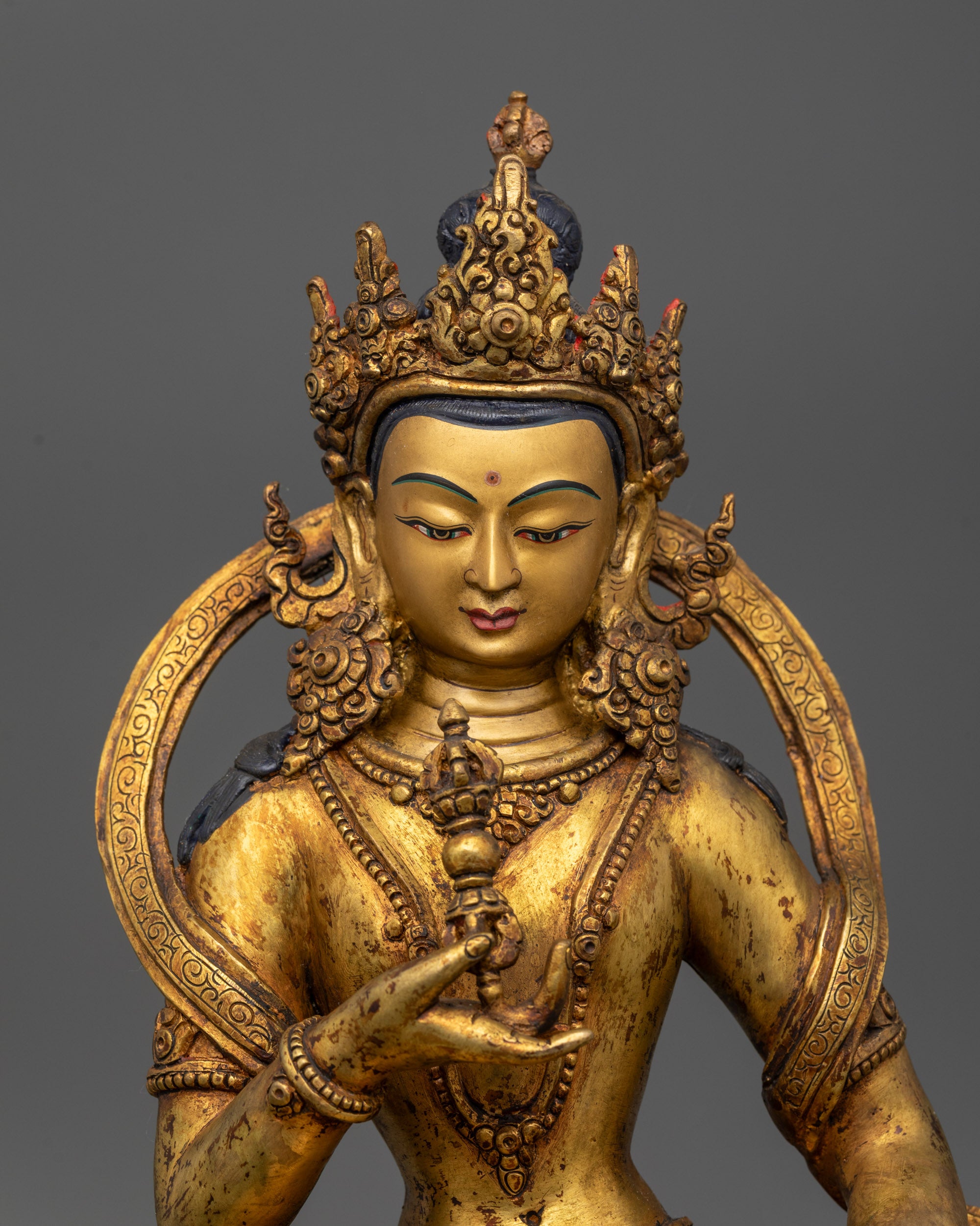 Close up of Vajrasattva holding vajra and bell on double-layered lotus base
