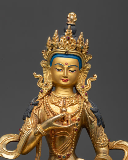 Close up of Vajrasattva statue showing intricate robe and semi-precious stone details
