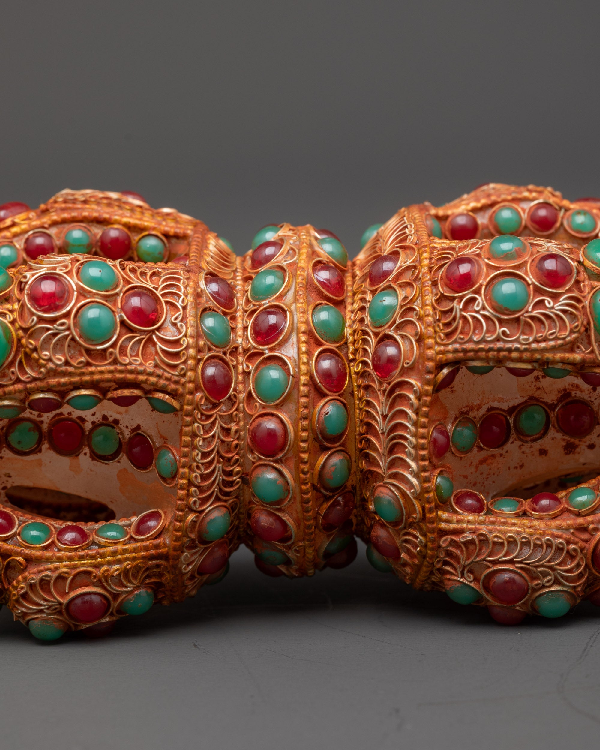 Close up of double-ended Dorje showing lotus-inspired ends and central band