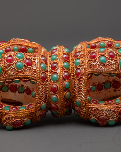 Close up of double-ended Dorje showing lotus-inspired ends and central band