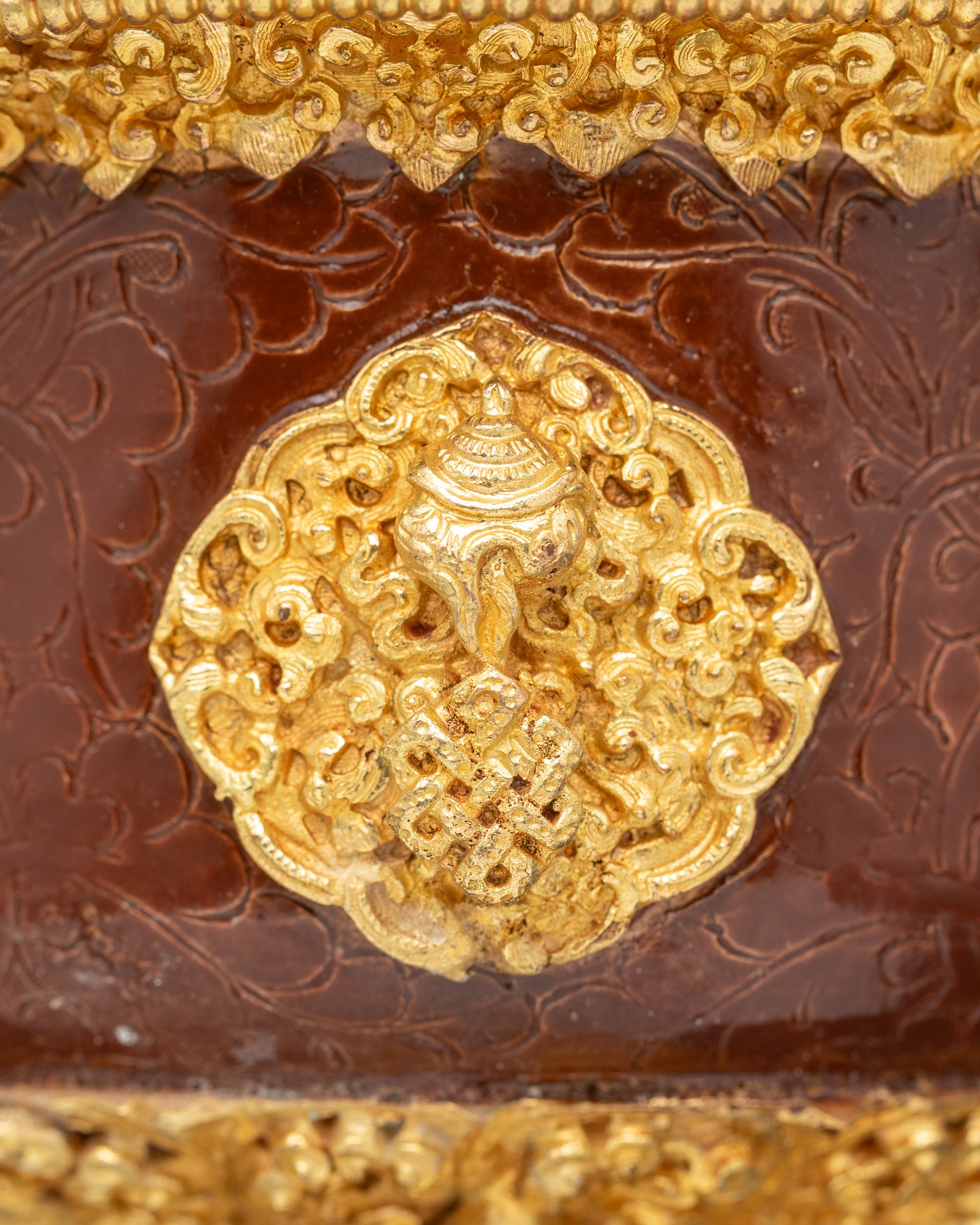 Close up of dual Himalayan butter lamps showing vibrant hand-applied colors