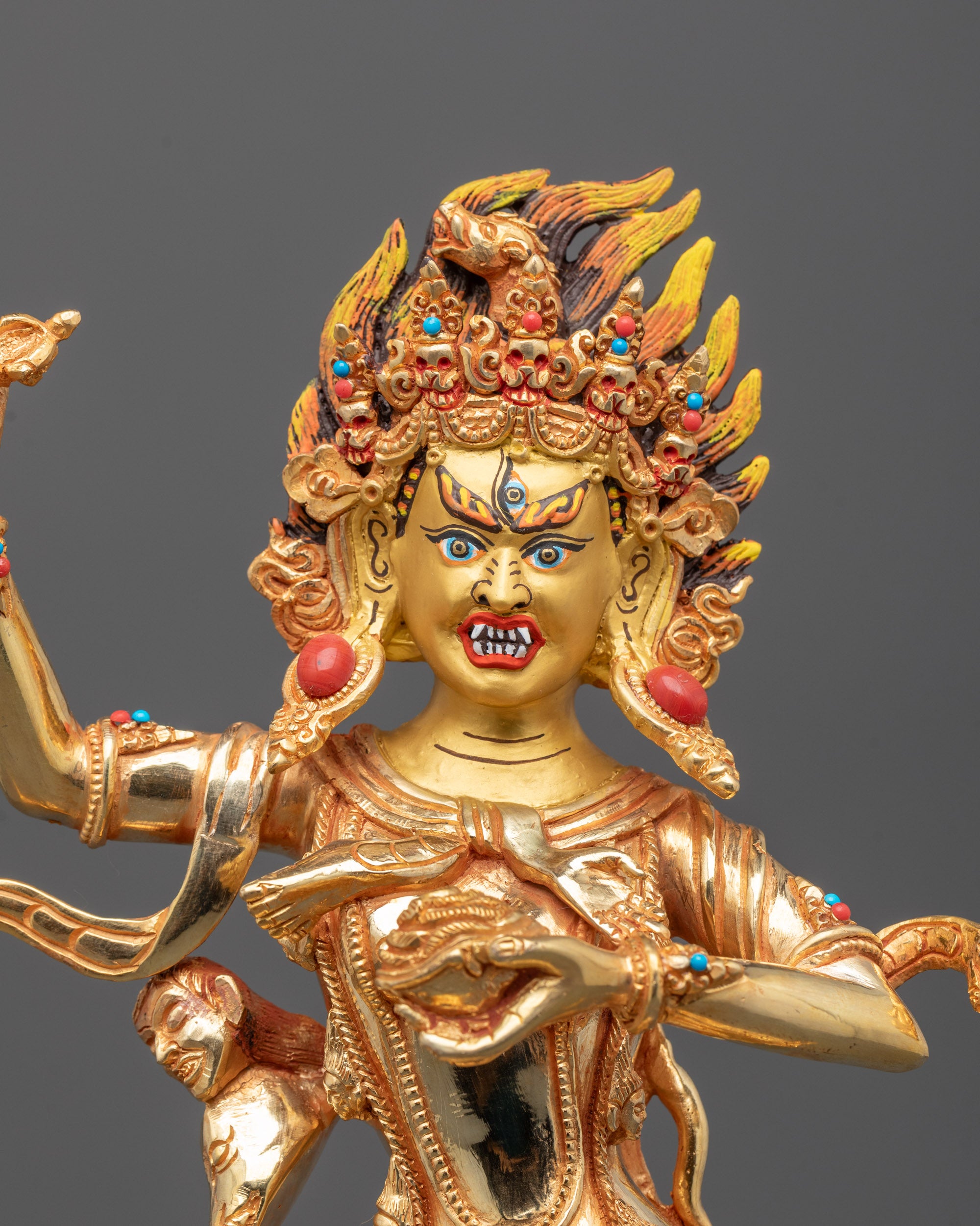 Close up of gilded Troma Nagmo Dakini sculpture showing intricate Chöd lineage details