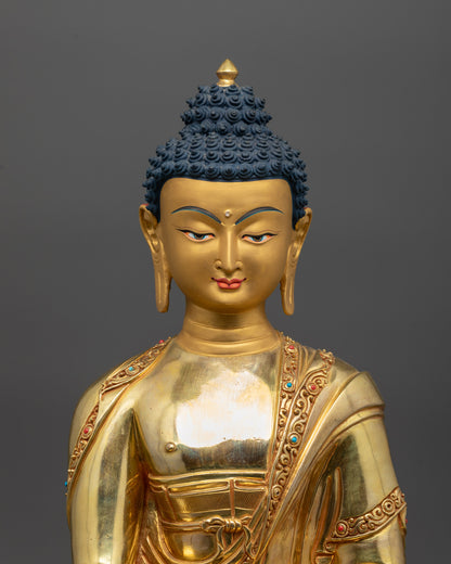 Close up of intricate carvings and semi-precious stones on the monk’s robe of Buddha statue