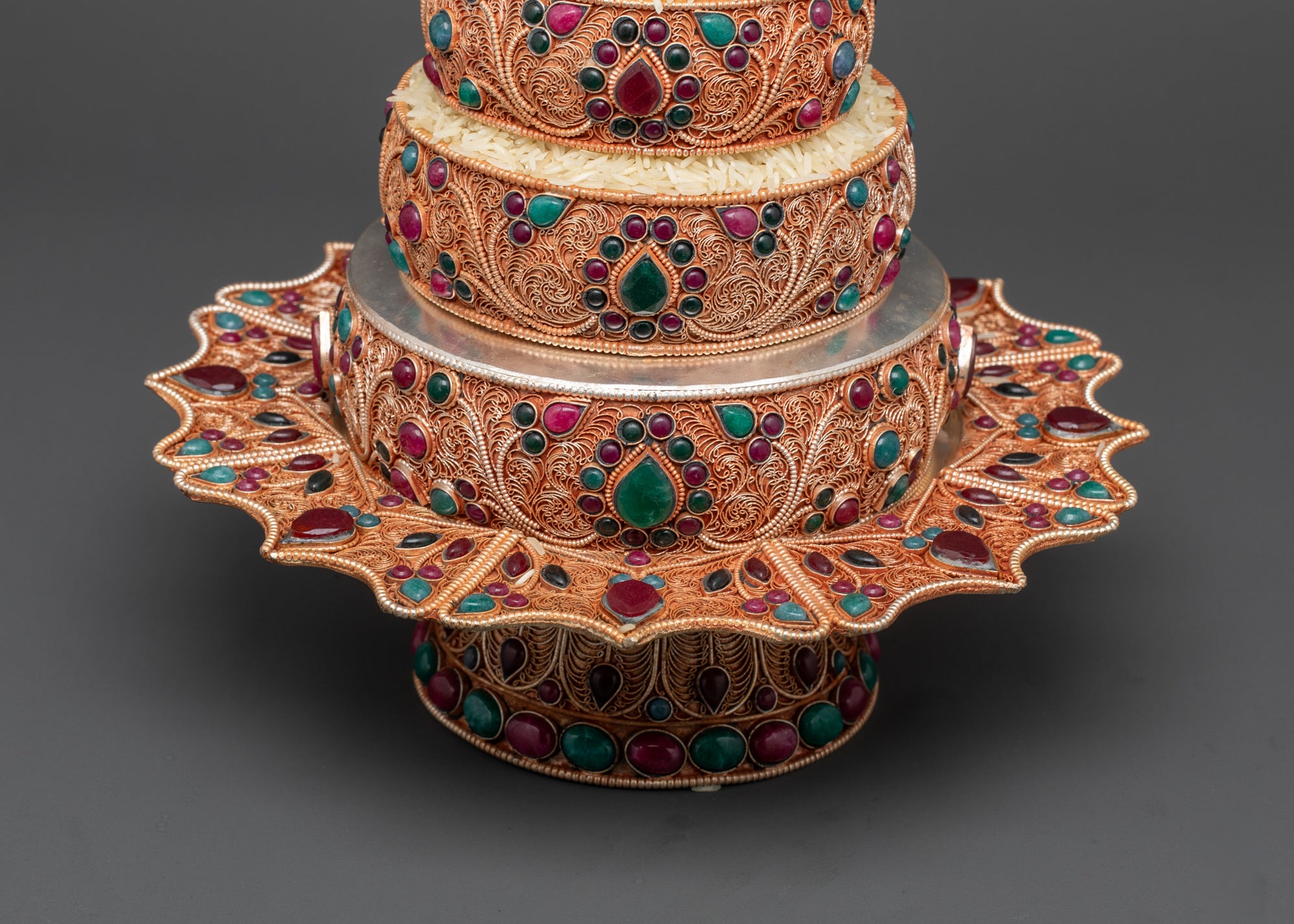 Close up of intricate filigree and semi-precious stones on Tibetan Ratna Mandala