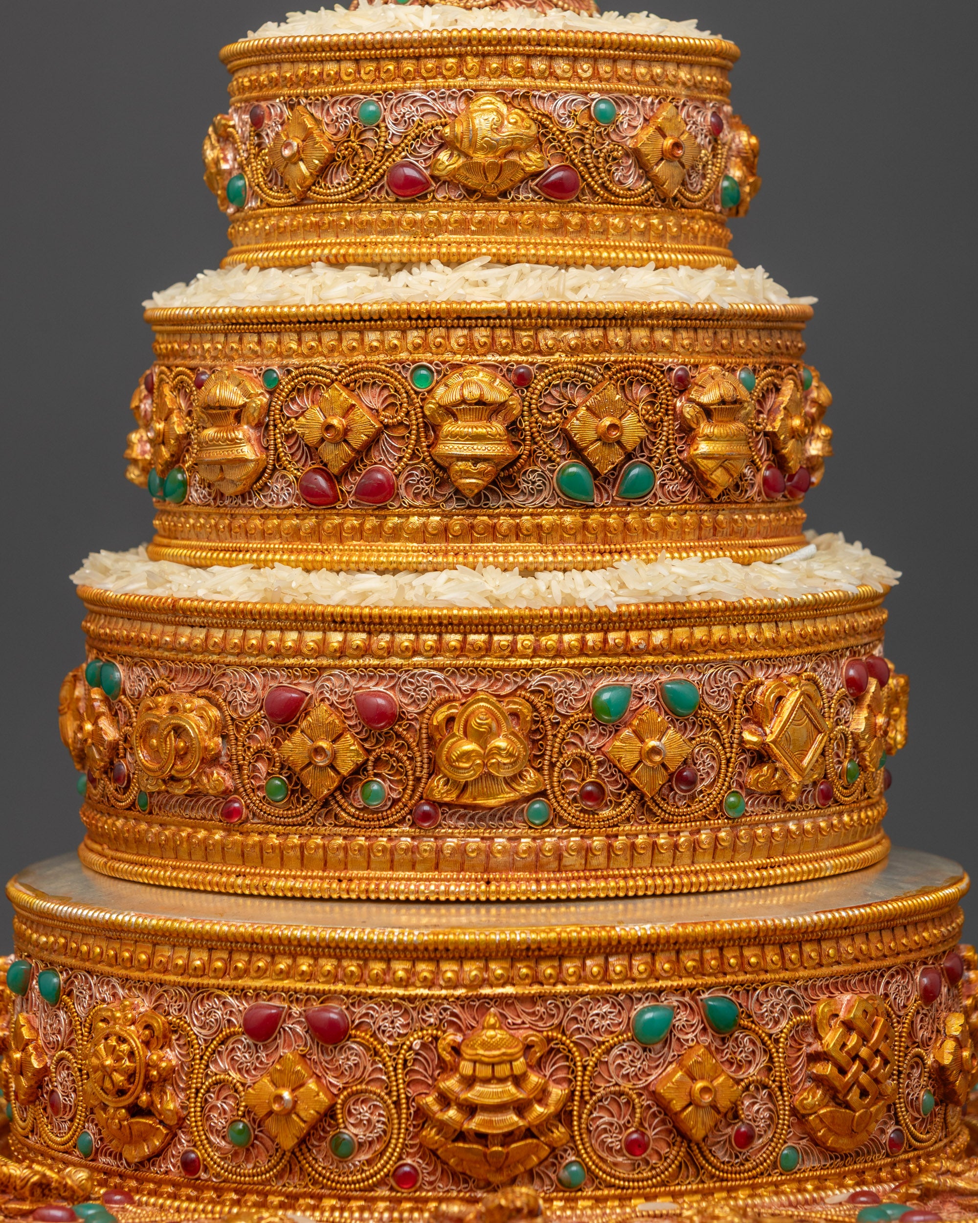 Close up of intricate filigree and semi-precious stones on Tibetan Austa Ratna Mandala